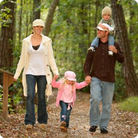family-walking-woods