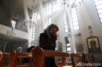 woman-praying-in-a-church-in-middle-east